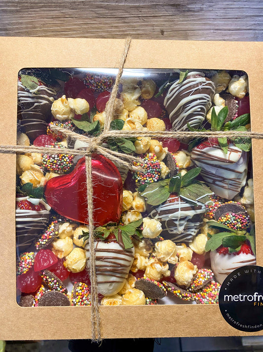 Strawberry delight box filled with delicious treats perfect to spoil a sweet tooth.